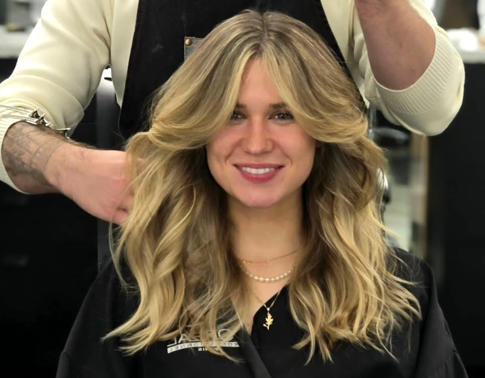 Curly hair diffused for definition rather than straightened