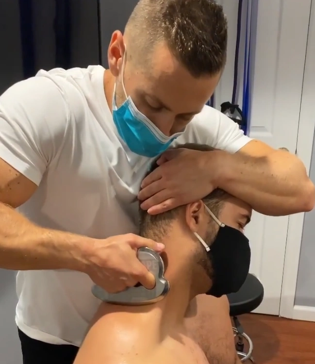 Sustained trigger point pressure during deep tissue massage at Erothots
