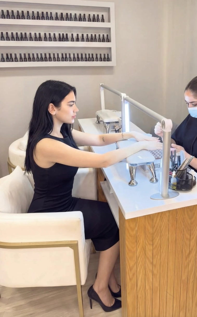 Cuticle oil being worked in after a gel manicure at Erothots