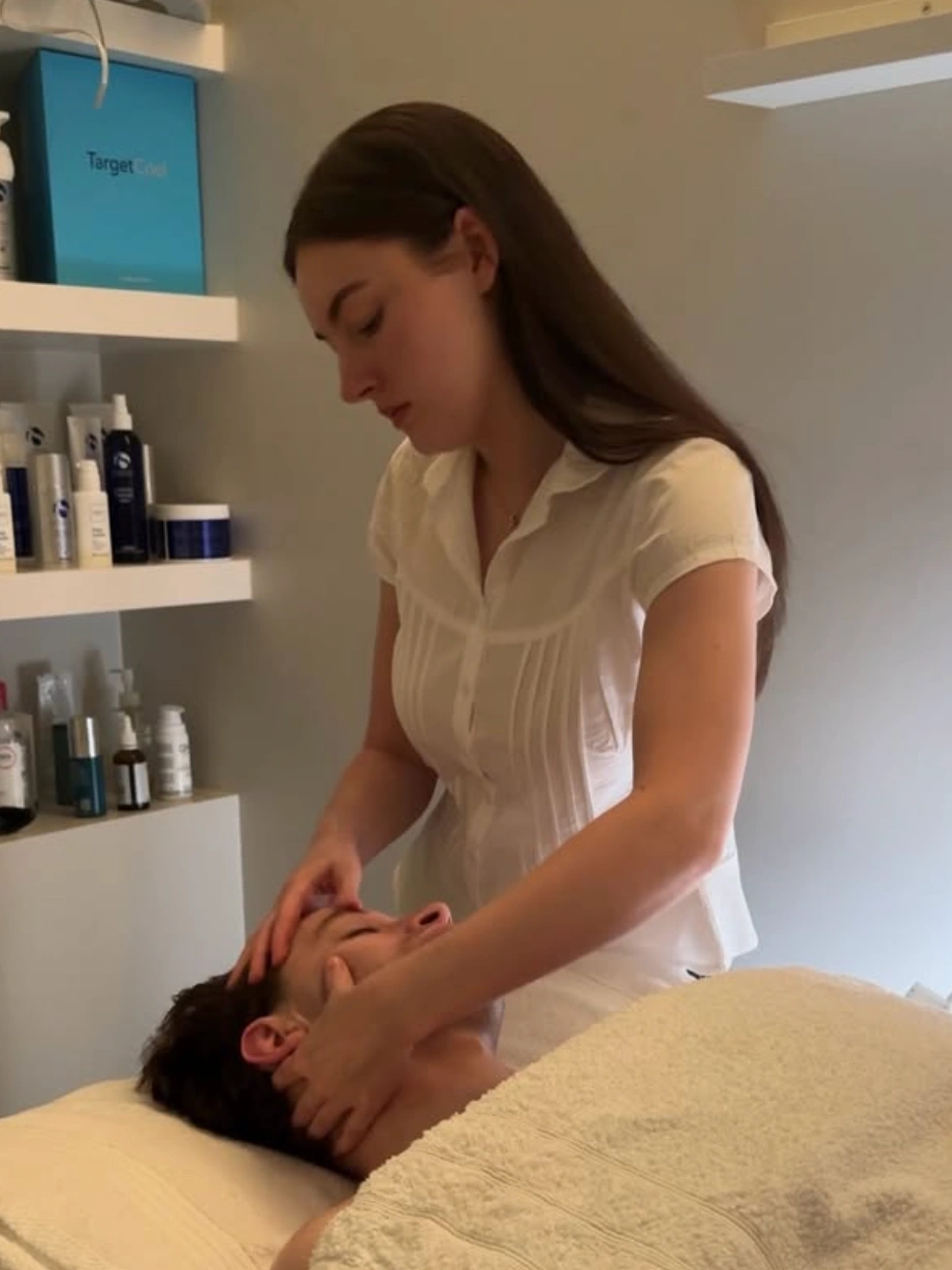 Skin being double cleansed at the start of a classic facial