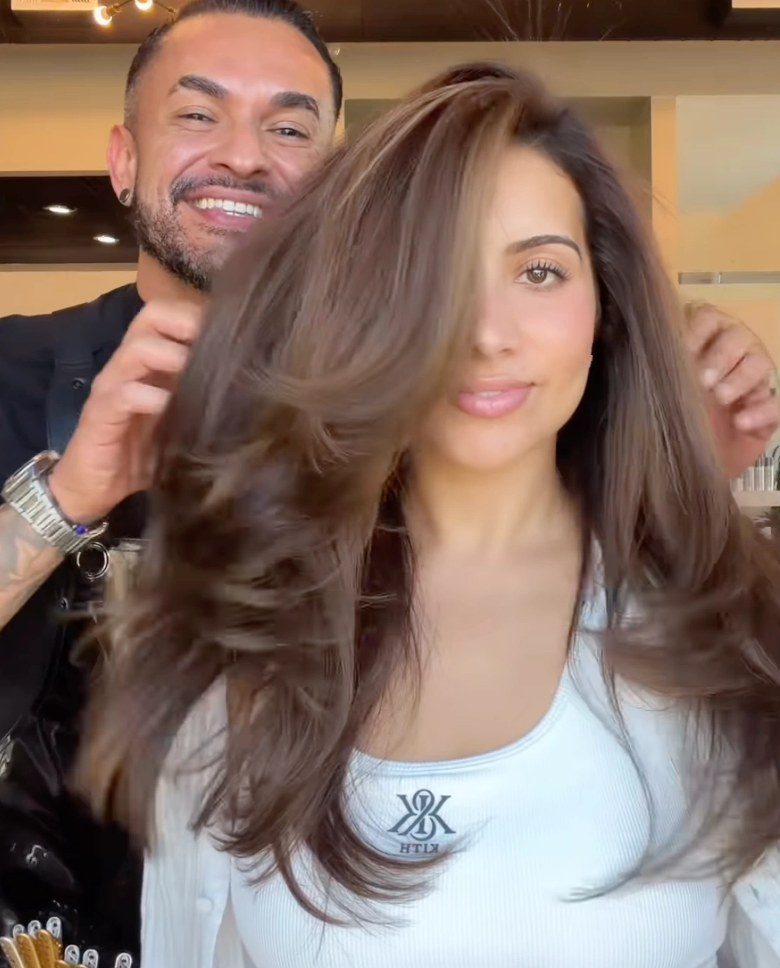 Stylist consulting with a client before a hair service at Erothots