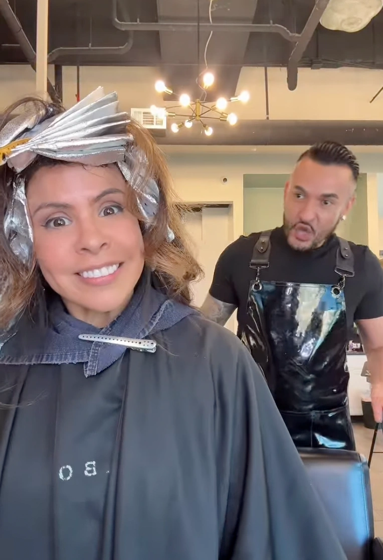 Color consultation with swatches held against the hairline at Erothots